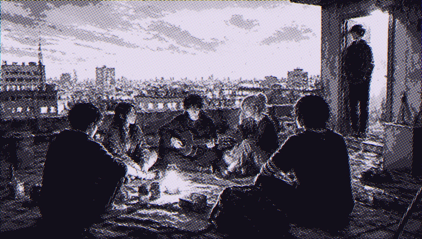 A small group of teenagers sitting in a circle on a rooftop at dusk while one keeps watch by the doorway