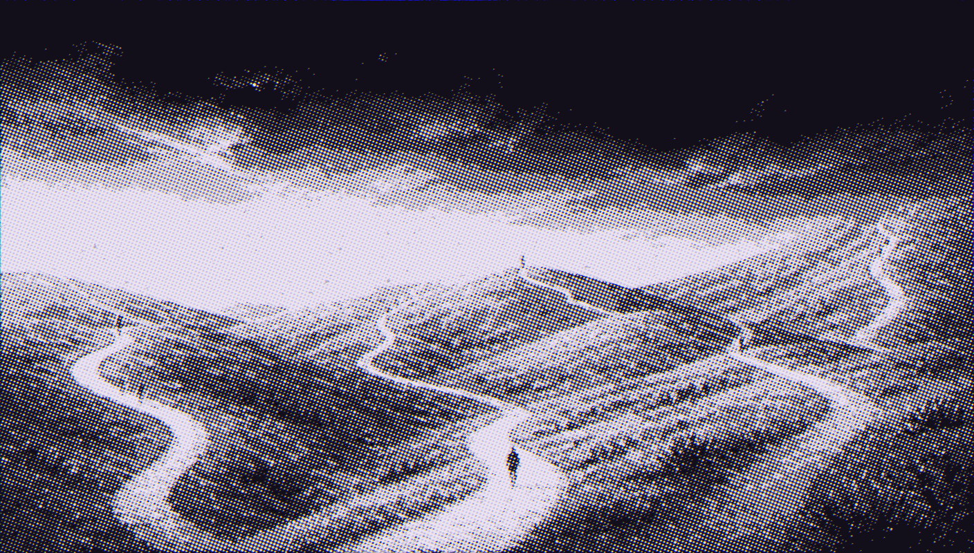 Several separate winding paths across dusk-lit hills, each walked by a single distant figure